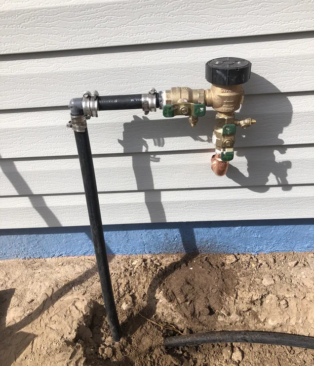 Gering Valley technician servicing a commercial plumbing system