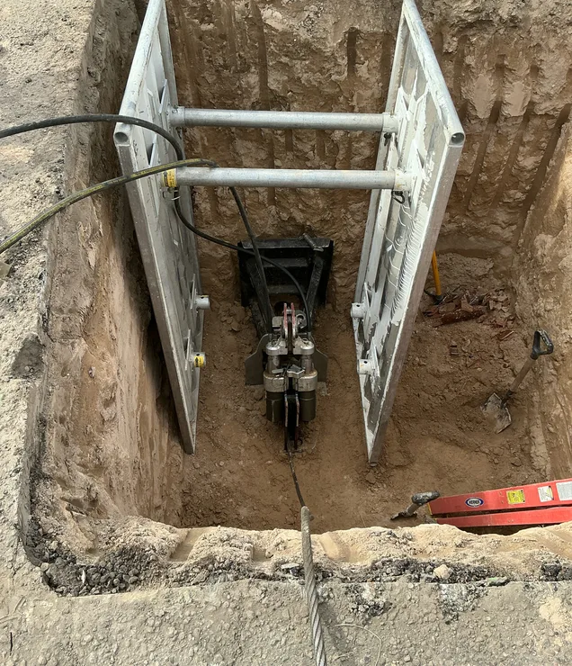 Gering Valley technician inspecting a drain field installation site