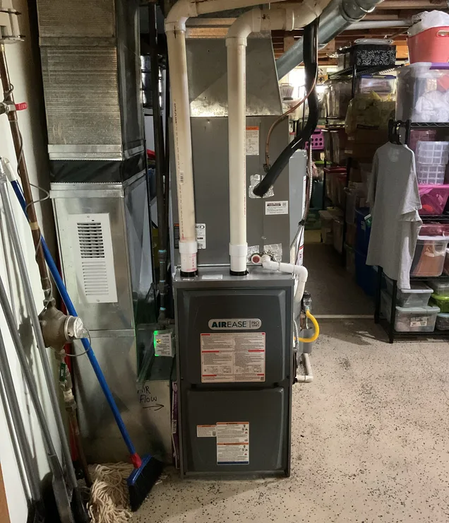 Gering Valley technician servicing a gas furnace in a Nebraska Panhandle home