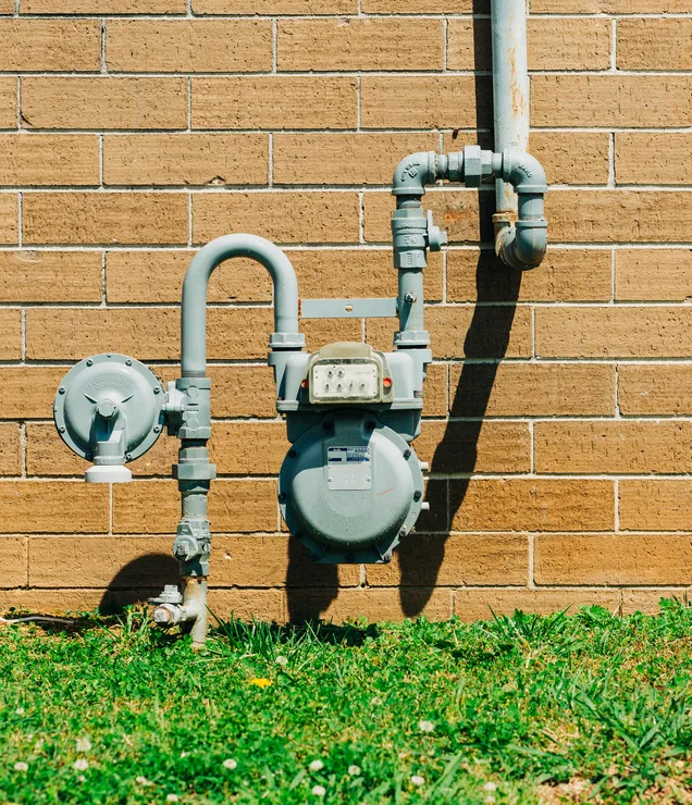 Residential gas meter and piping serviced by Gering Valley Plumbing & Heating