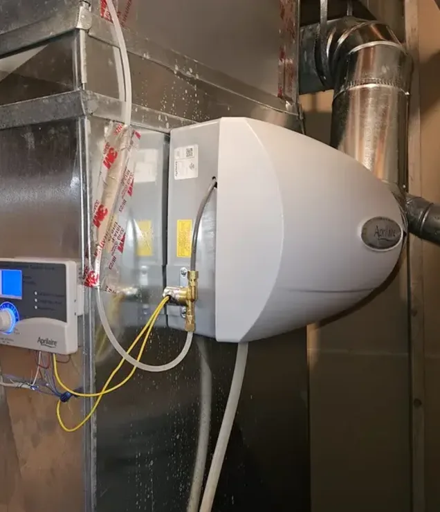 Whole-home humidifier installed on ductwork by Gering Valley Plumbing & Heating