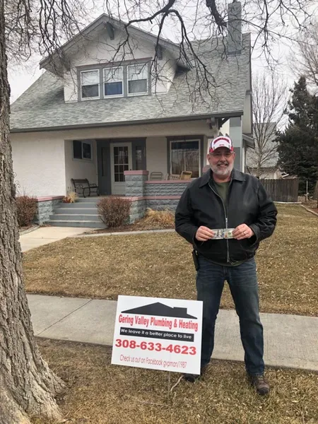 February yard-sign winner Danny with their Gering Valley Plumbing & Heating sign