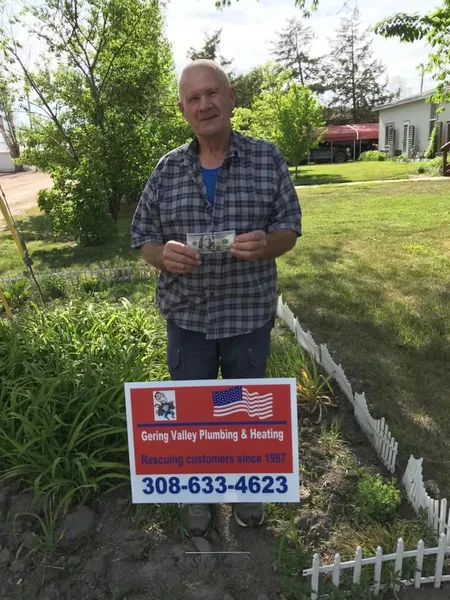 May yard-sign winner Glen with their Gering Valley Plumbing & Heating sign
