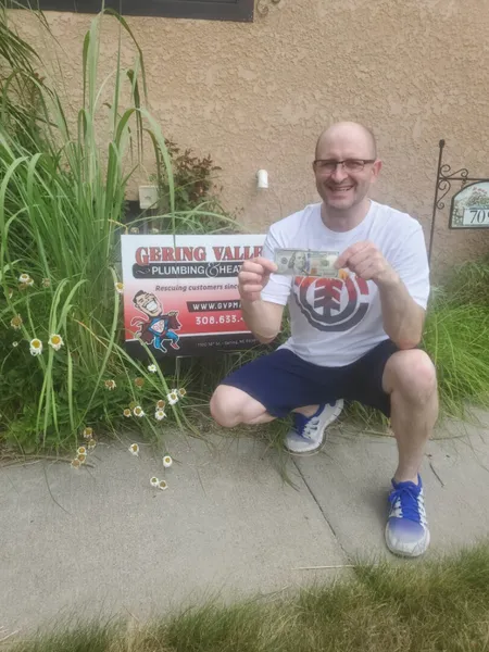 August yard-sign winner Jesse M with their Gering Valley Plumbing & Heating sign