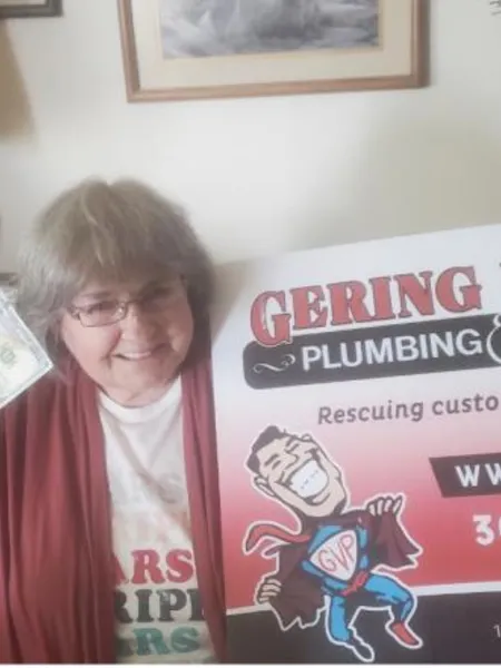 September yard-sign winner Shirley G with their Gering Valley Plumbing & Heating sign