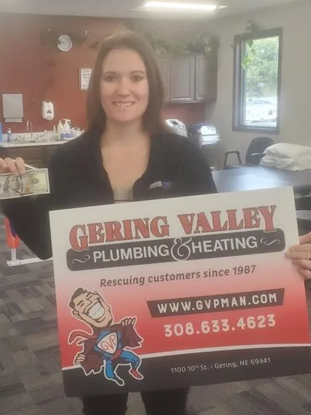 October yard-sign winner Taylor E with their Gering Valley Plumbing & Heating sign