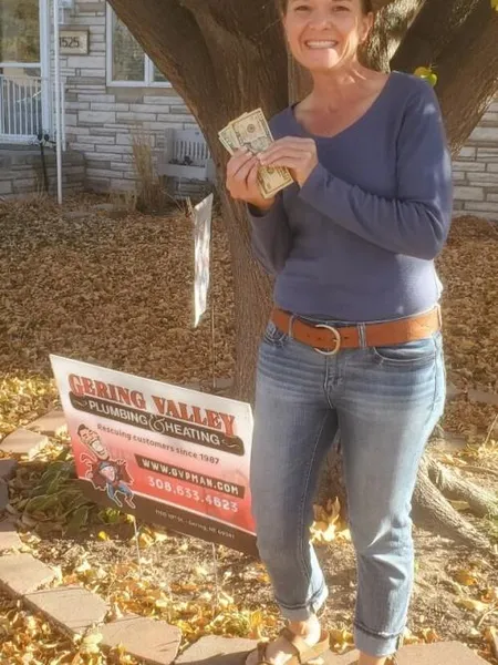 November yard-sign winner Sarah L with their Gering Valley Plumbing & Heating sign
